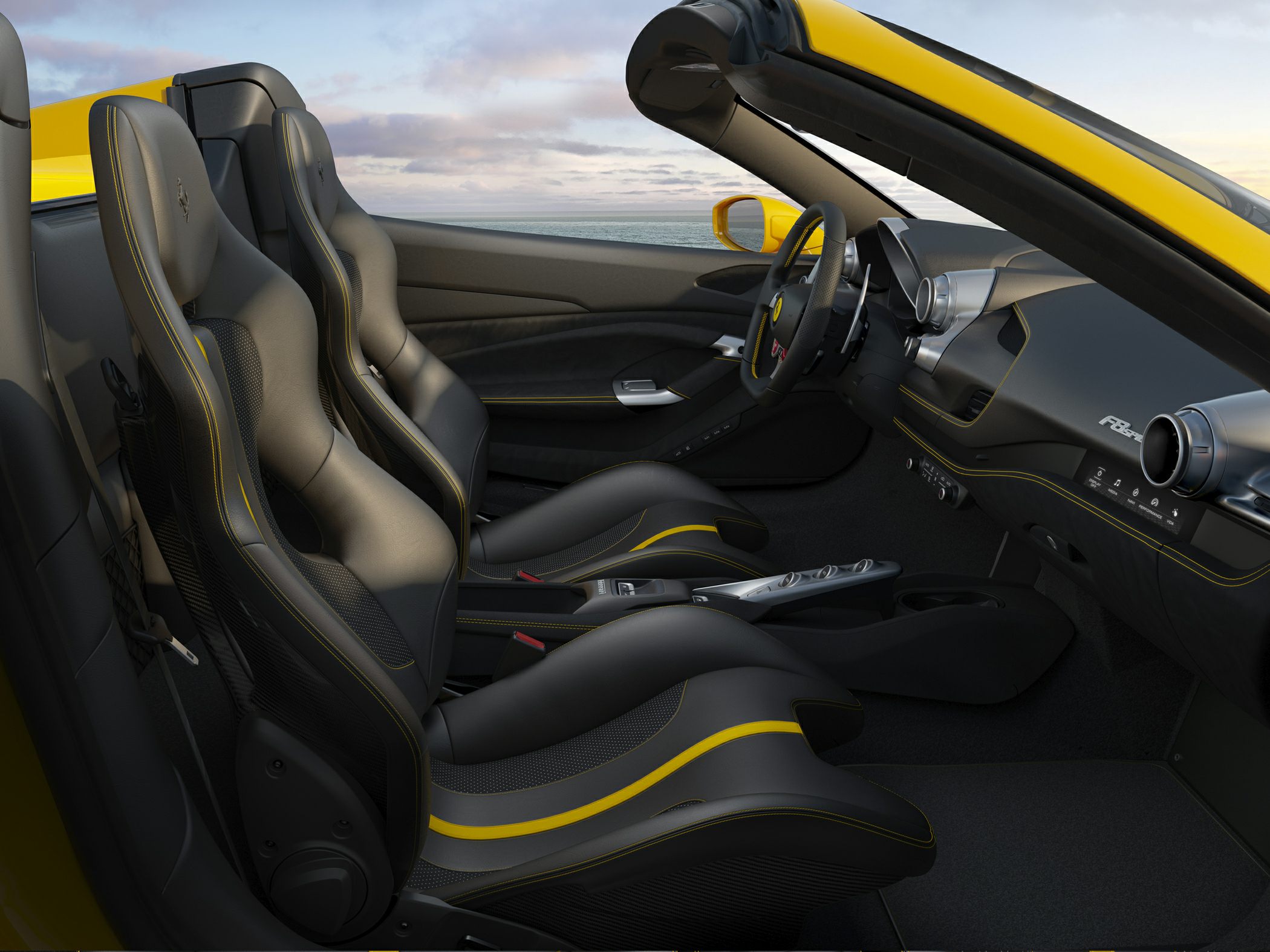 Sporty black leather bucket seats with yellow accents and sleek dashboard interior.