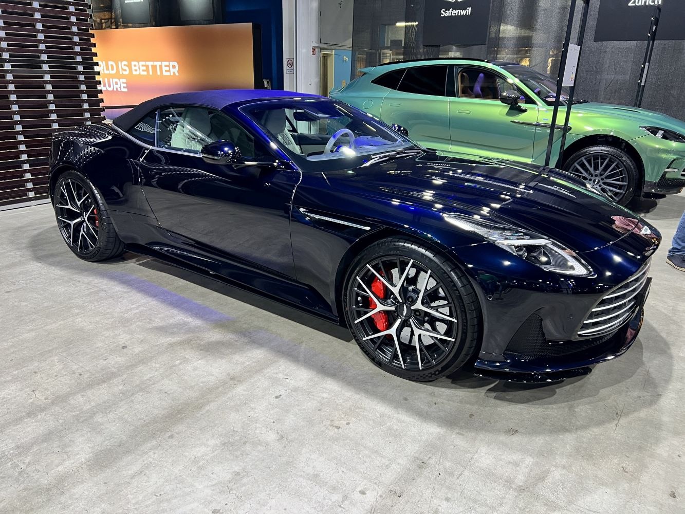 Convertible with soft-top roof and distinctive alloy wheels with red brake calipers