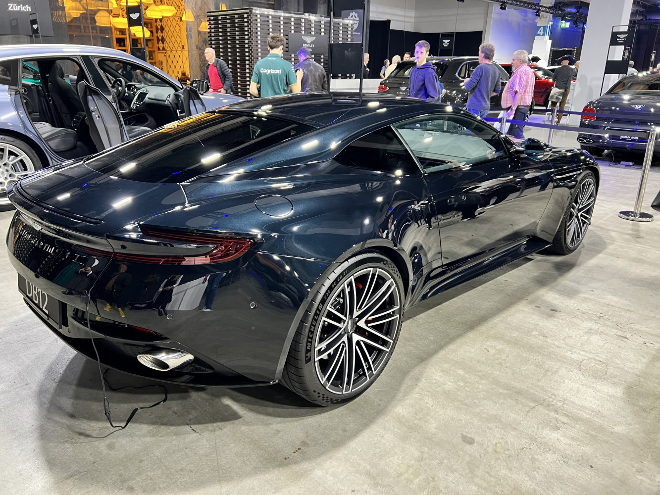 Rear side of luxury sports coupe with multi-spoke alloy wheels.