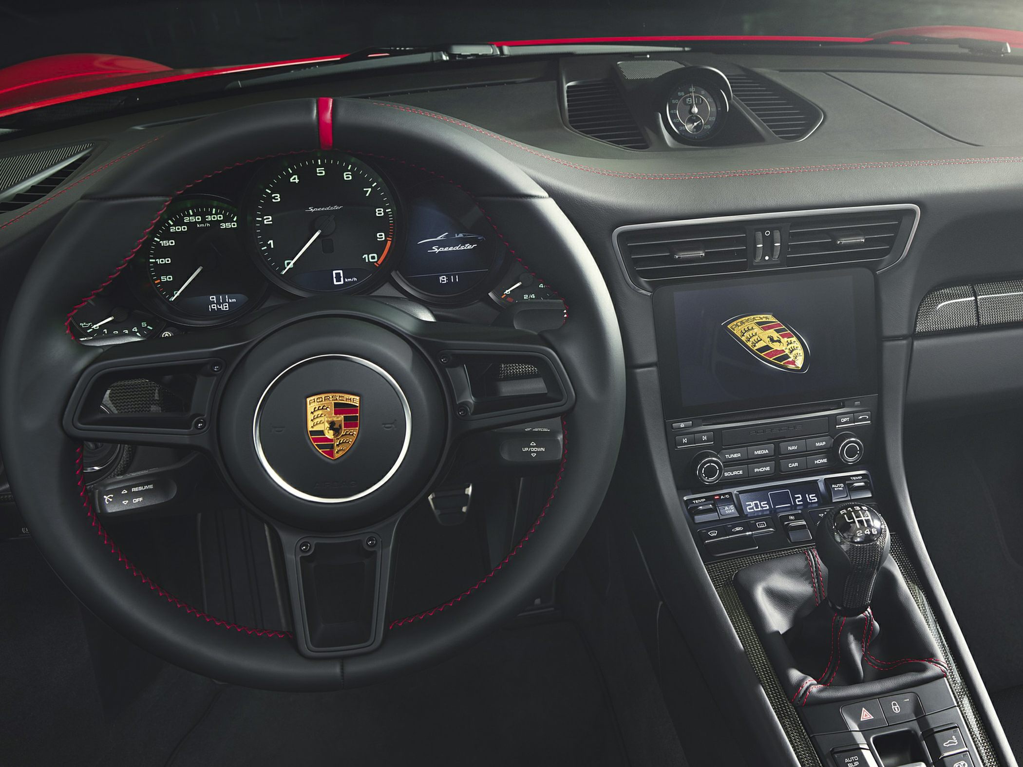 Manual transmission and dashboard with tachometer in sports car interior
