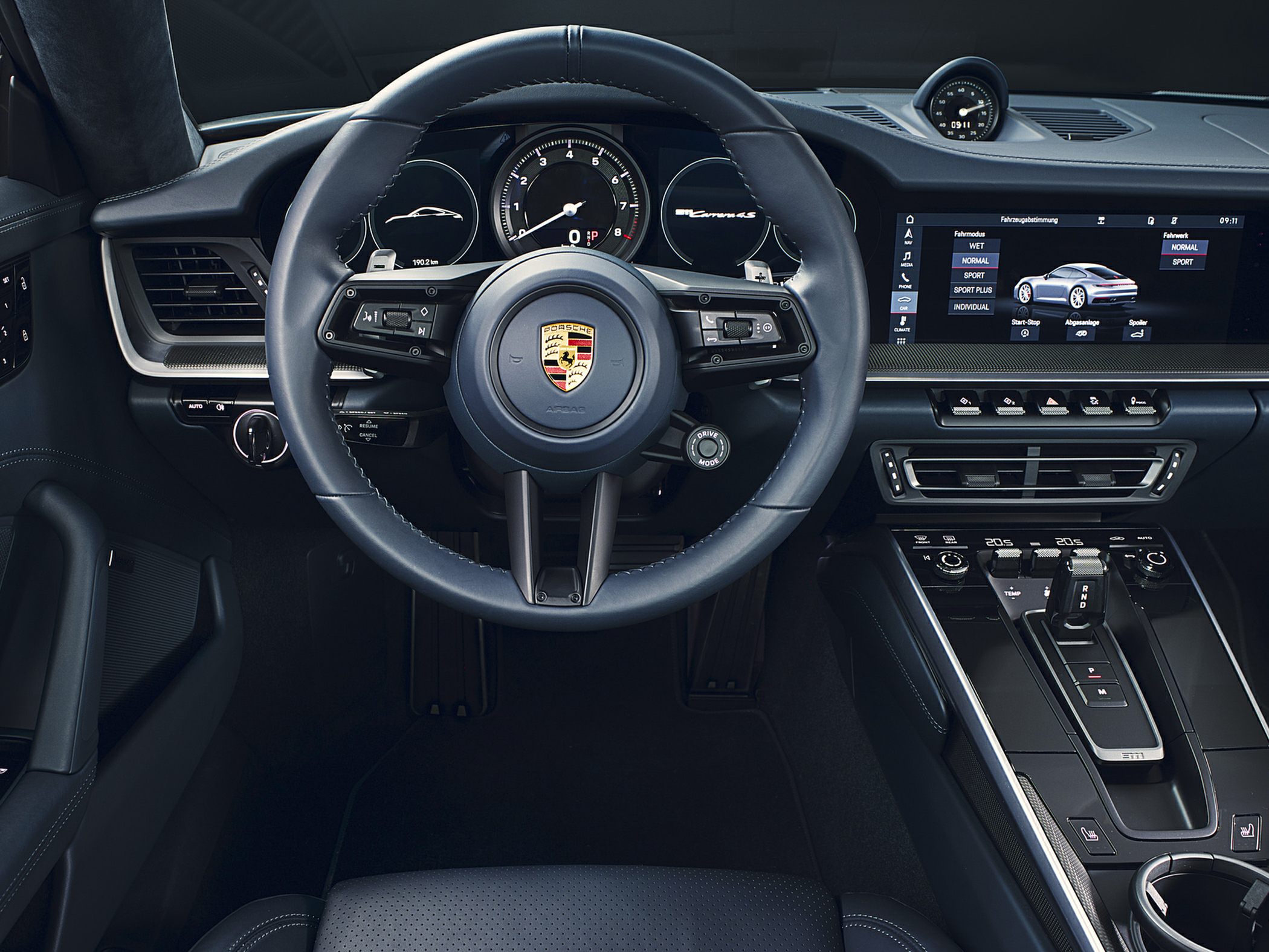 Steering wheel, digital instrument cluster, central touchscreen display