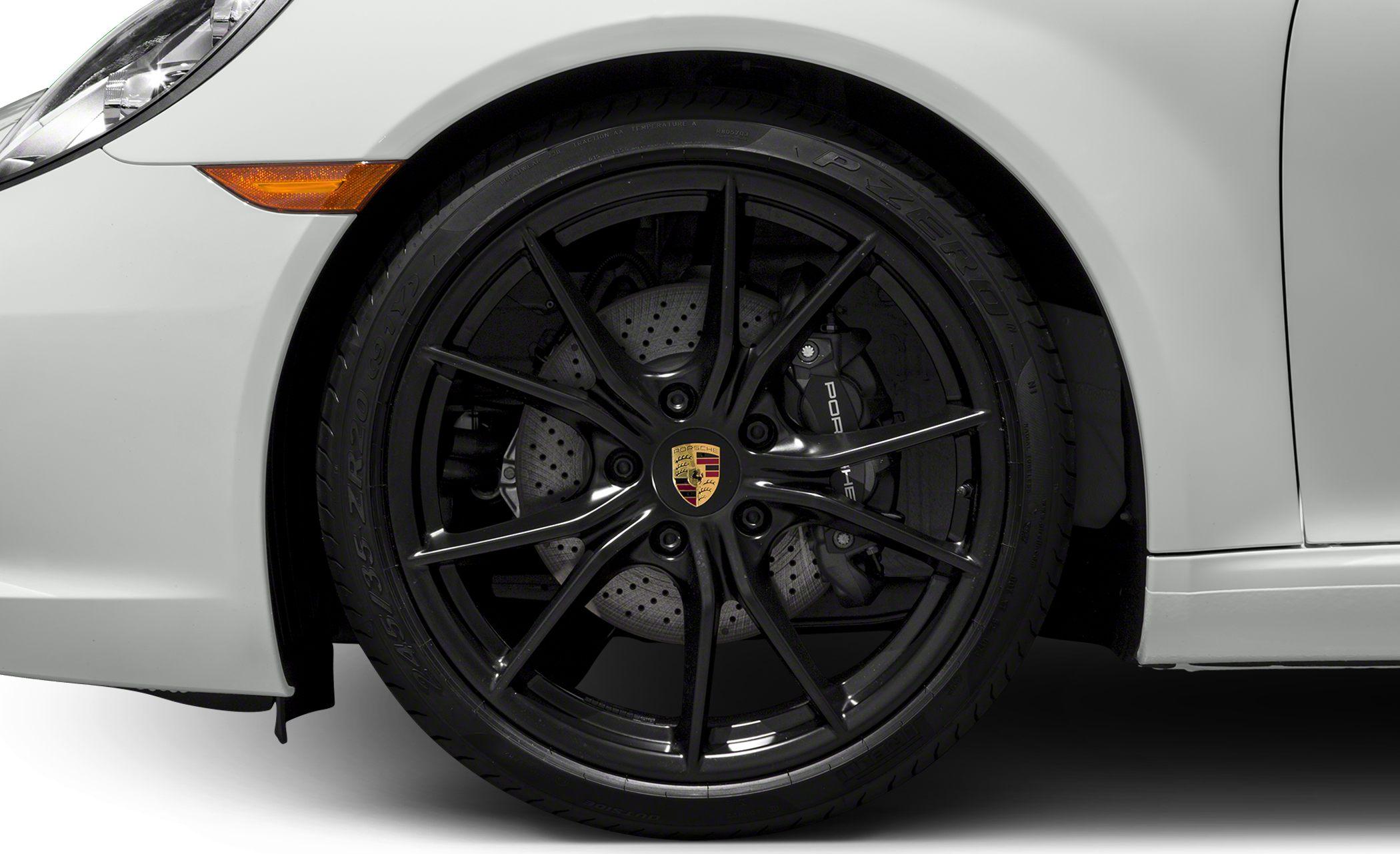 Front wheel with black alloy rim and drilled brake disc