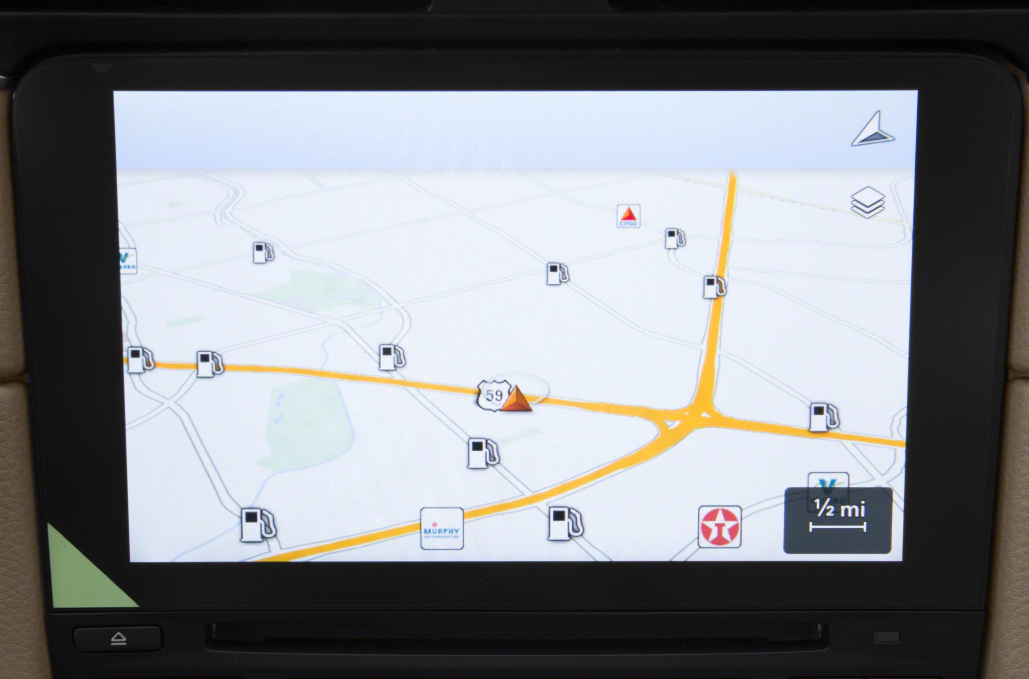 Digital navigation screen with map and fuel station icons