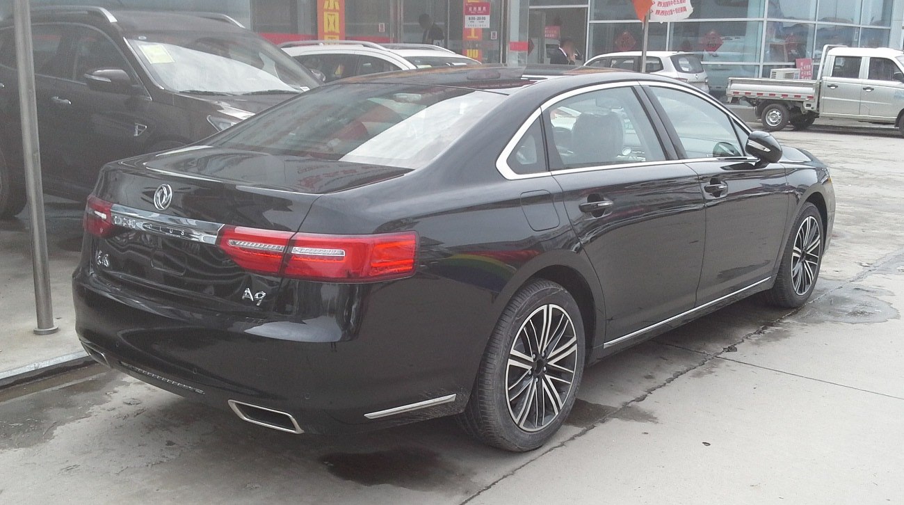 Luxury sedan rear with LED tail lights and dual exhaust