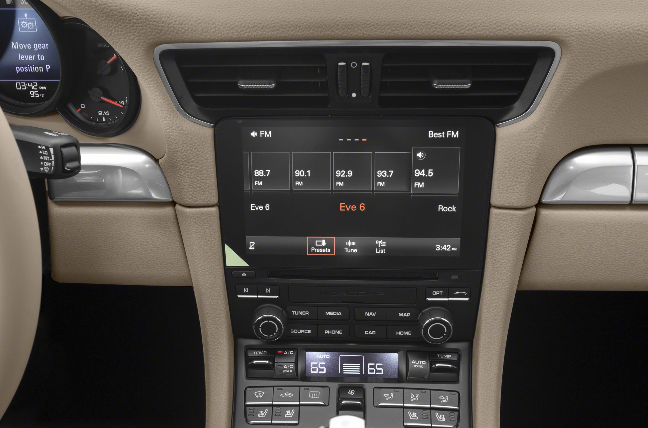Center console with touchscreen infotainment and climate controls in a luxury sports car interior