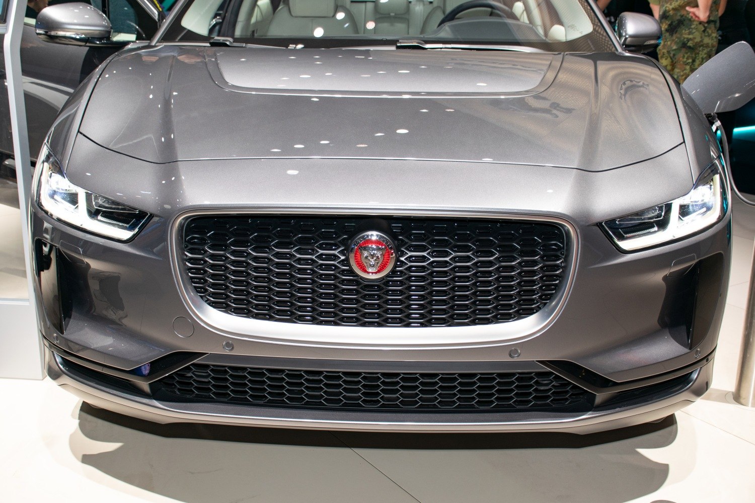 Front grille and sleek LED headlights of a modern electric SUV