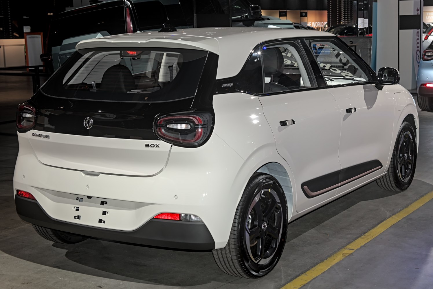 Rear and side view of a modern hatchback with distinctive tail lights and two-tone paint.