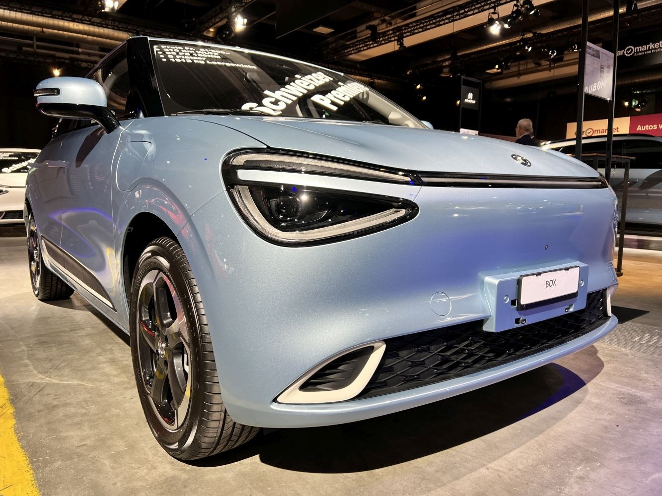 Close-up of sleek front with distinctive headlights and smooth bumper