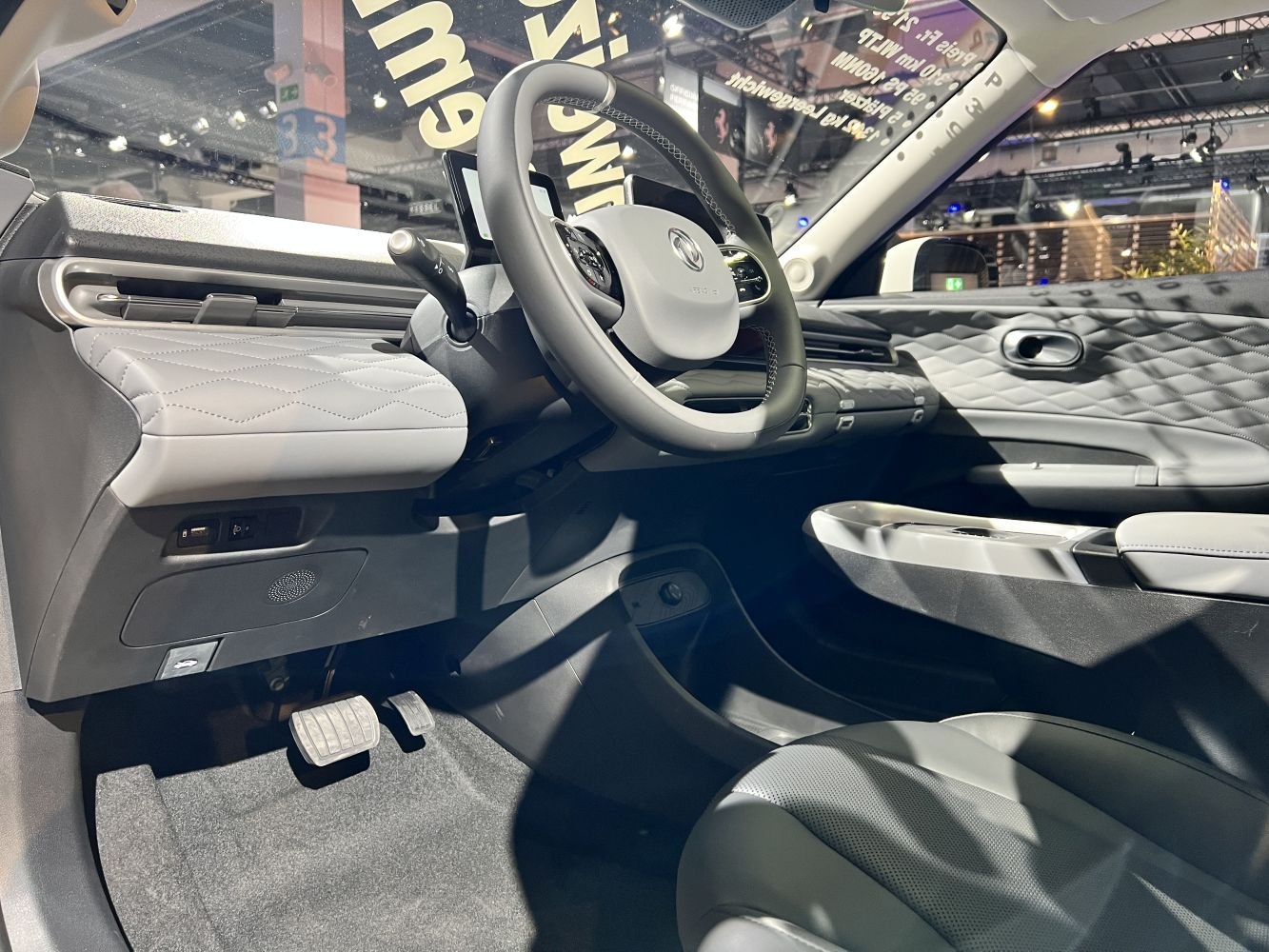 Modern car interior with quilted door panels and ergonomic dashboard