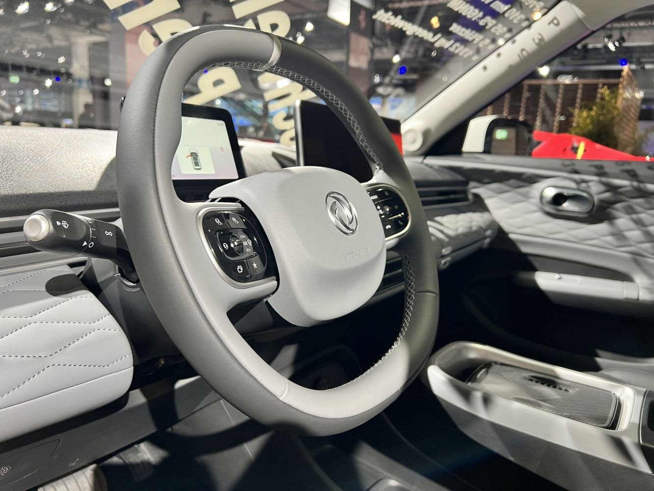 Modern steering wheel and digital dashboard in car interior