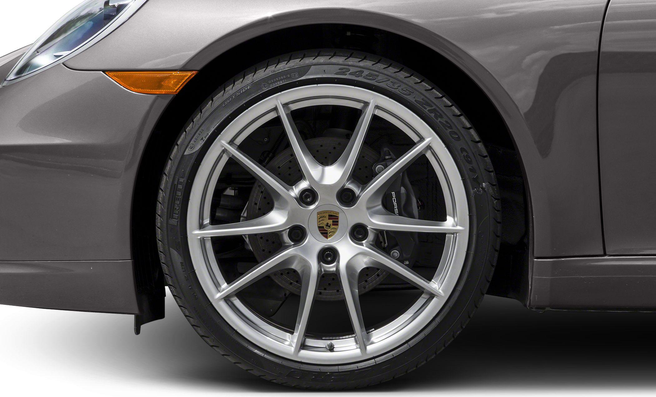 Close-up of alloy wheel with multi-spoke design and large disc brake.