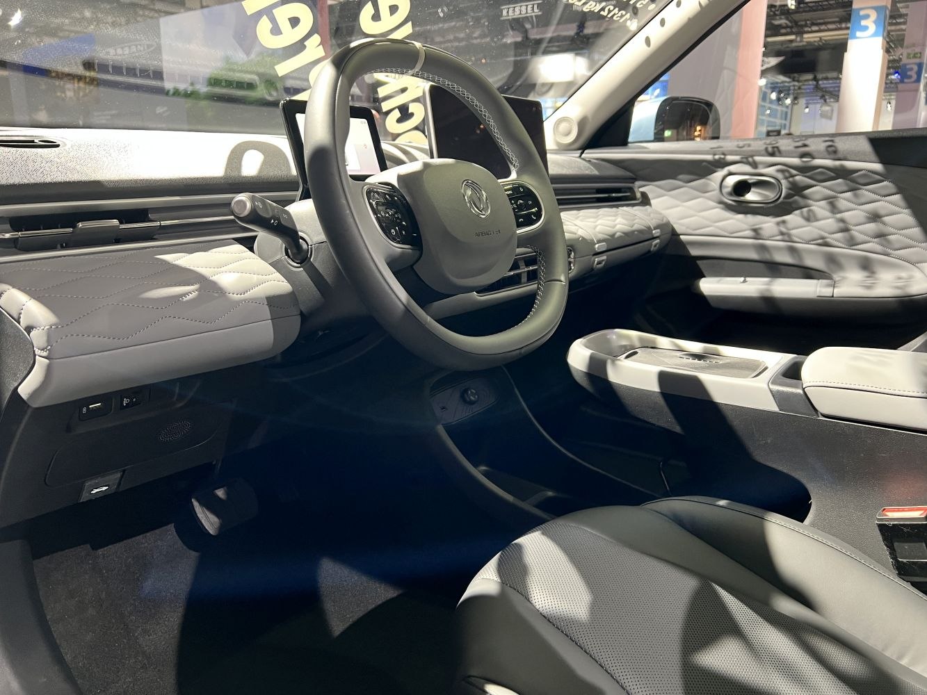 Modern dashboard and multifunction steering wheel with quilted leather upholstery