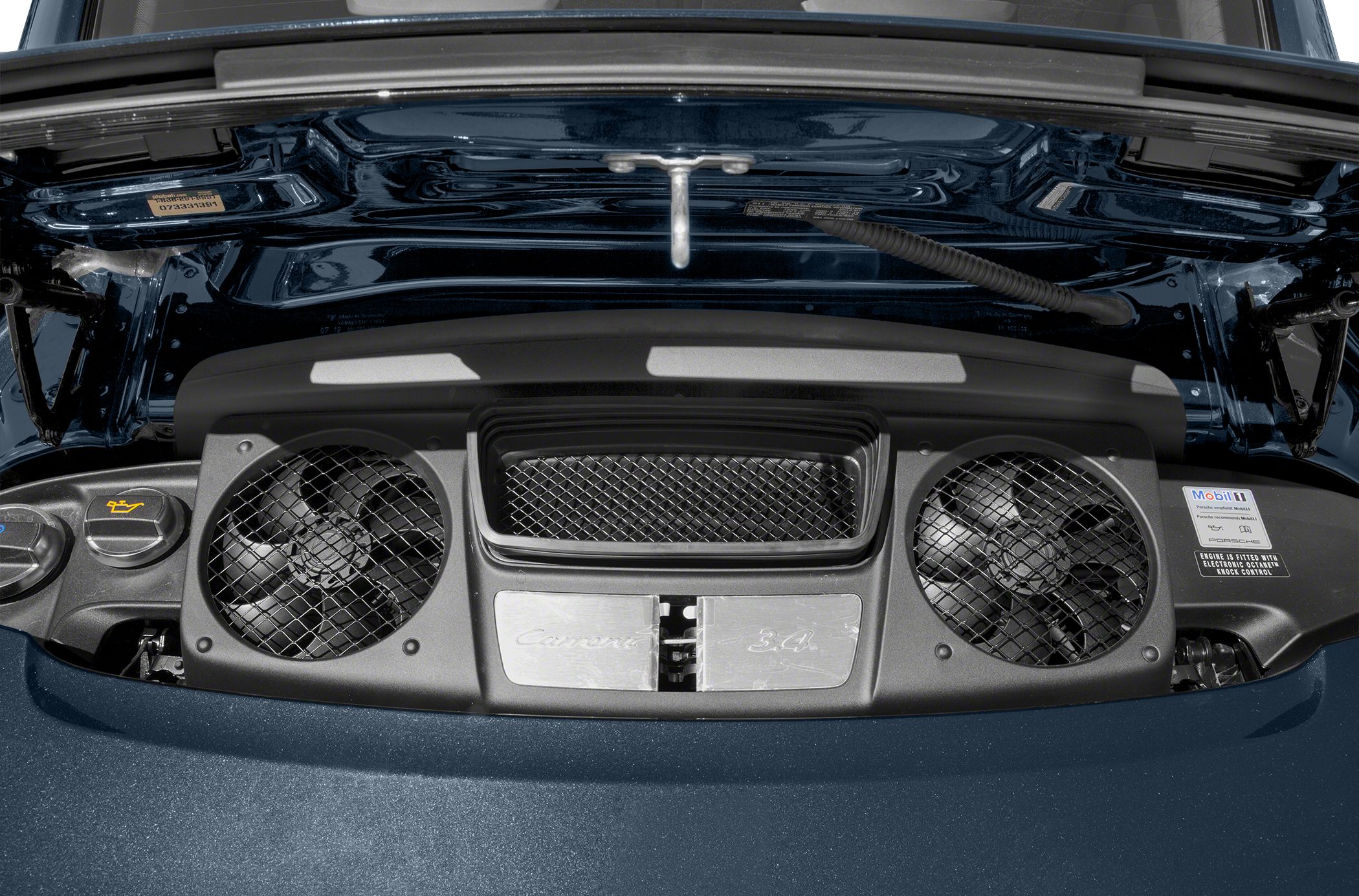 Rear engine compartment with cooling fans and air intakes