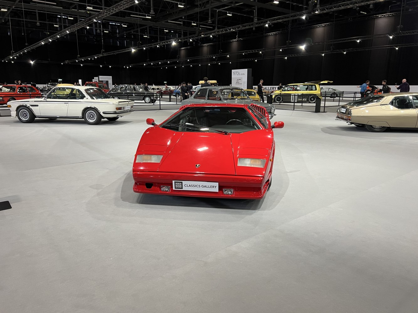Front view of red Lamborghini sports car with pop-up headlights