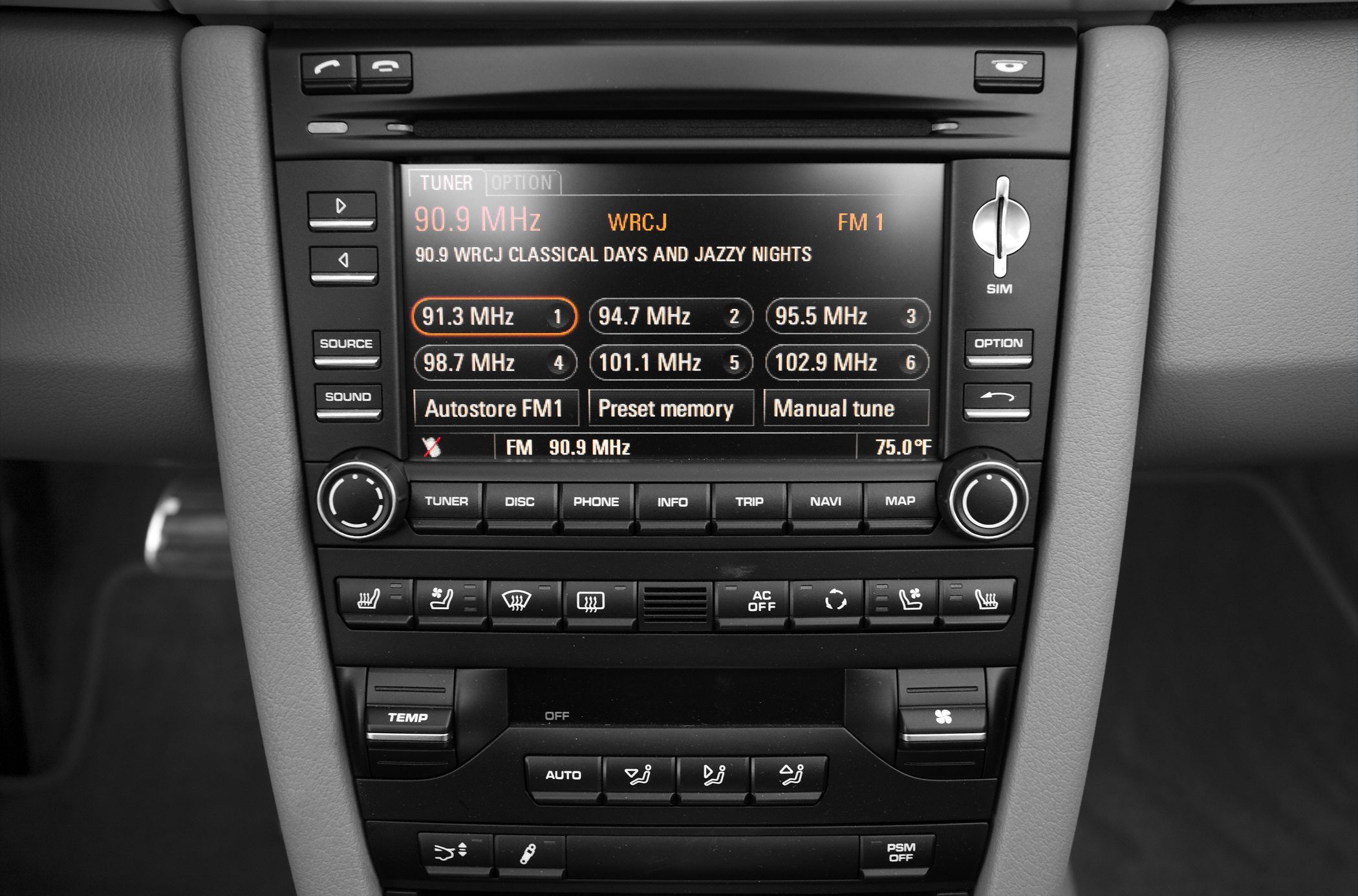 Car infotainment system and climate control panel with radio tuner and heated seat buttons