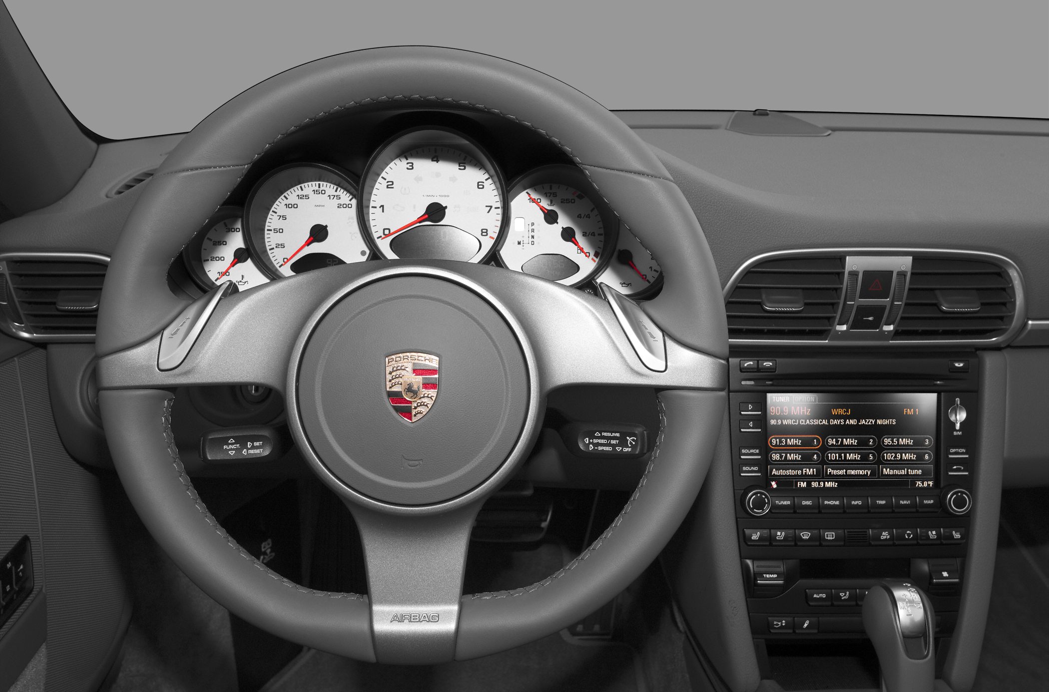 Luxury steering wheel with instrument cluster and center console display