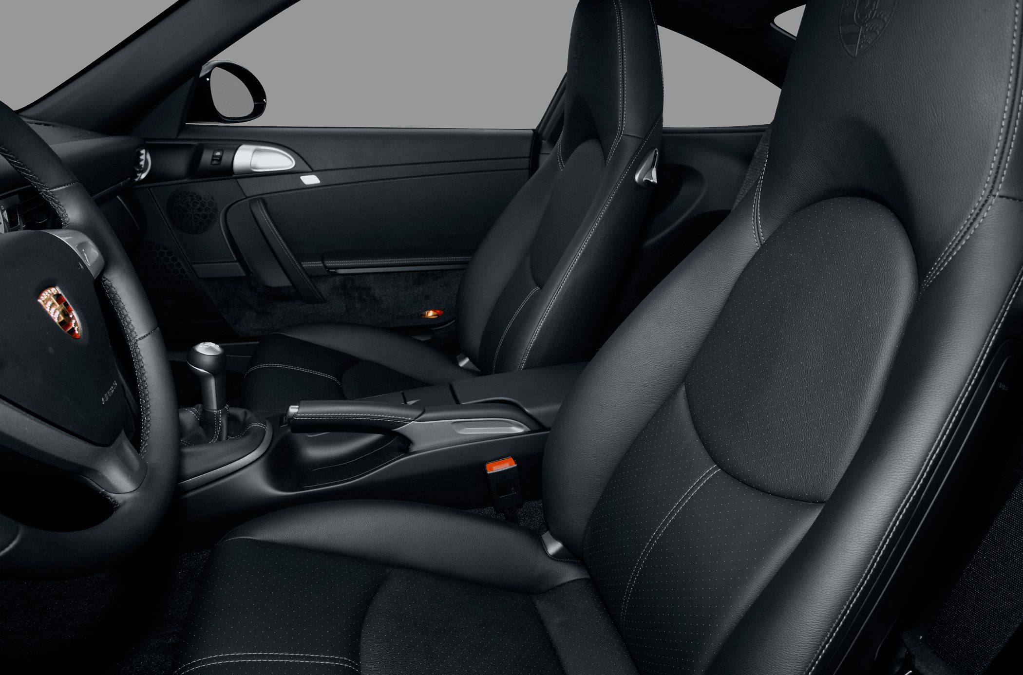 Black leather seats with detailed stitching and ergonomic design