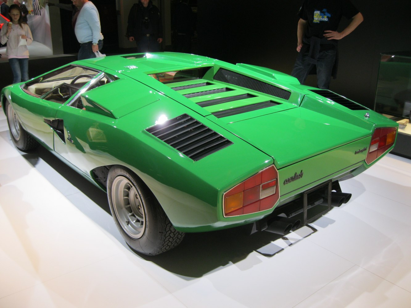 Angular rear design with slatted engine cover and rear air vents.