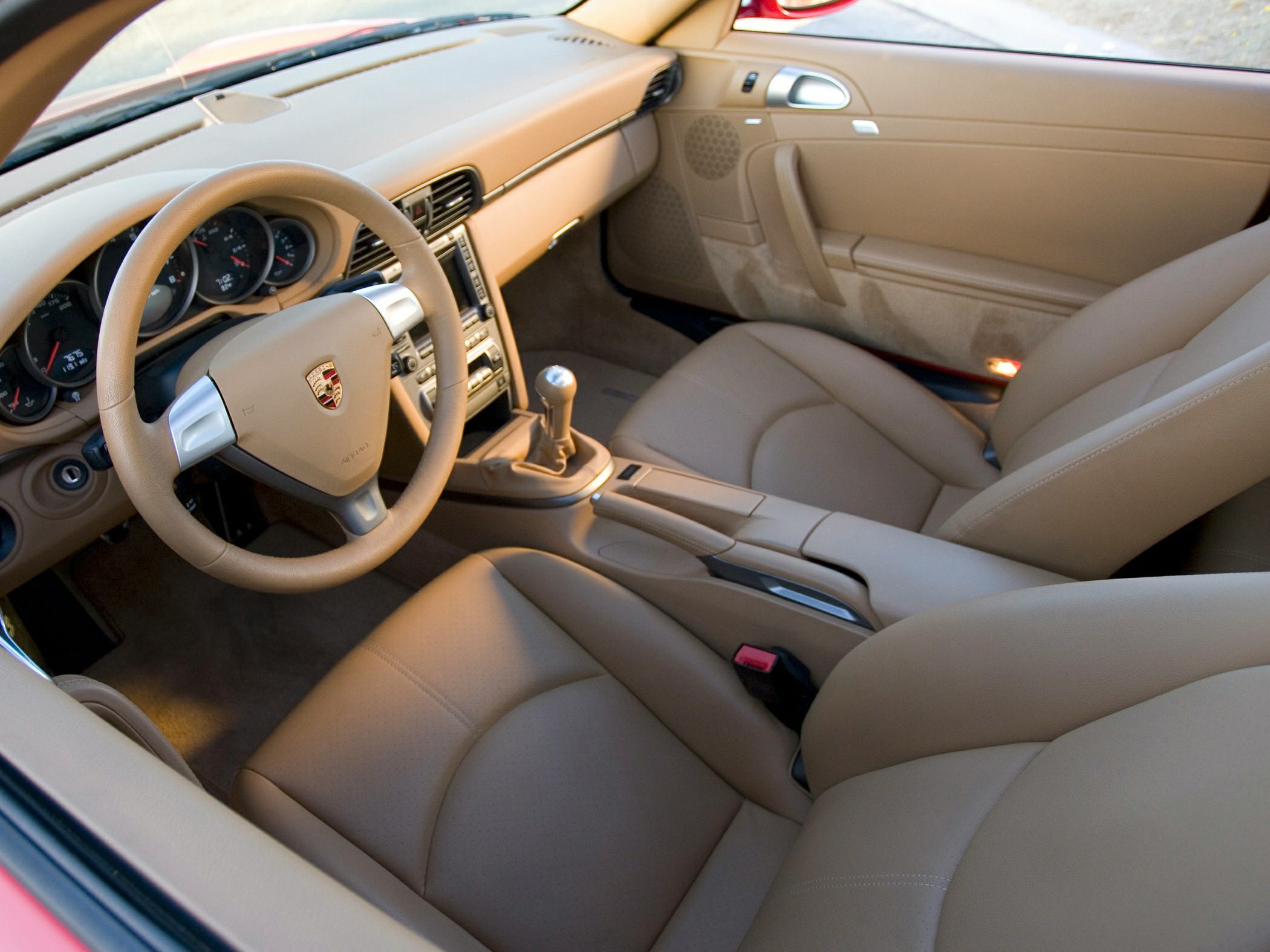 Beige leather interior with manual transmission and dashboard