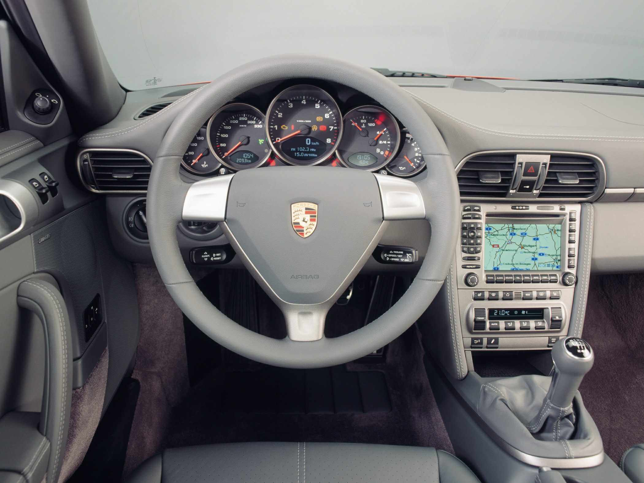Steering wheel, instrument cluster, navigation screen, and manual gear shifter