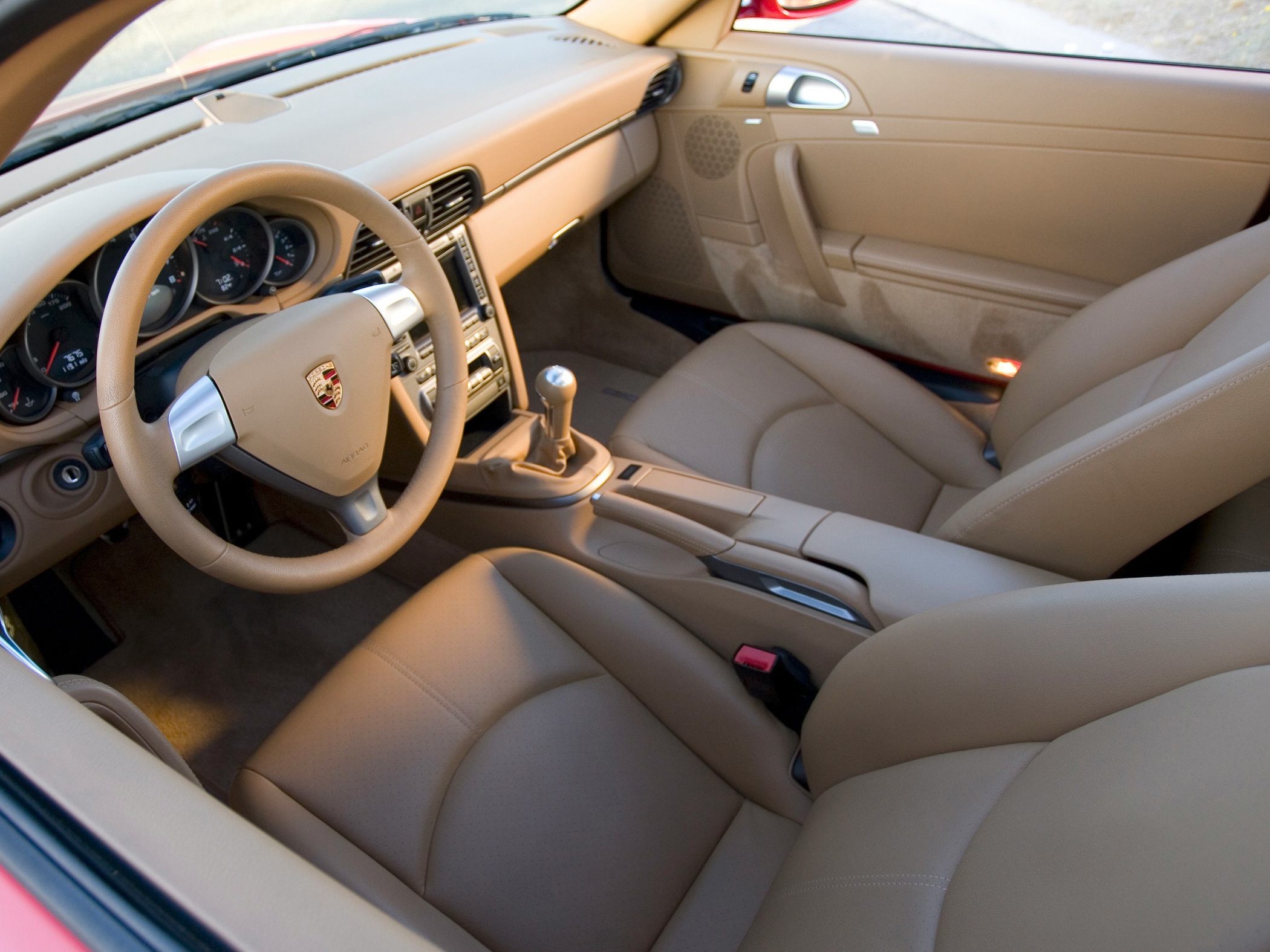 Beige leather interior with manual gear shift and classic Porsche dashboard
