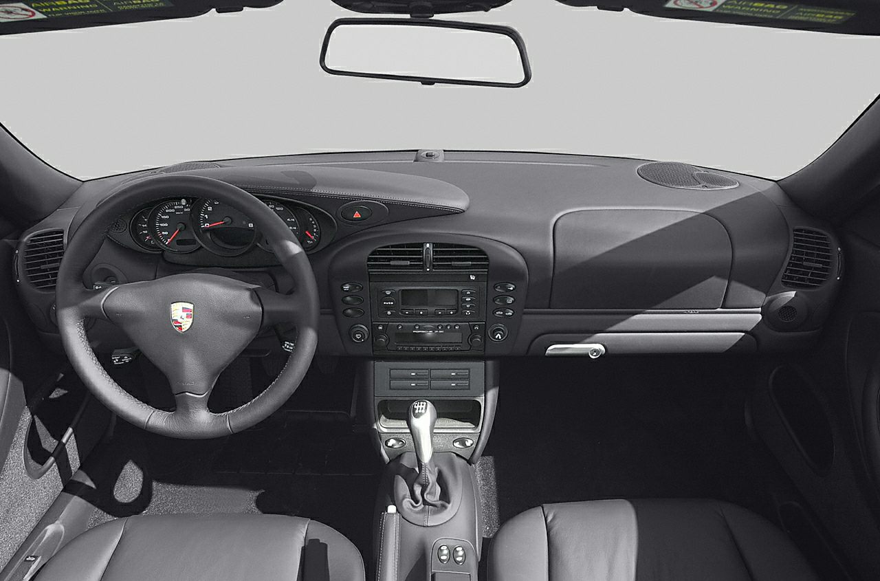 Dashboard, steering wheel, and manual gear shift of a car interior
