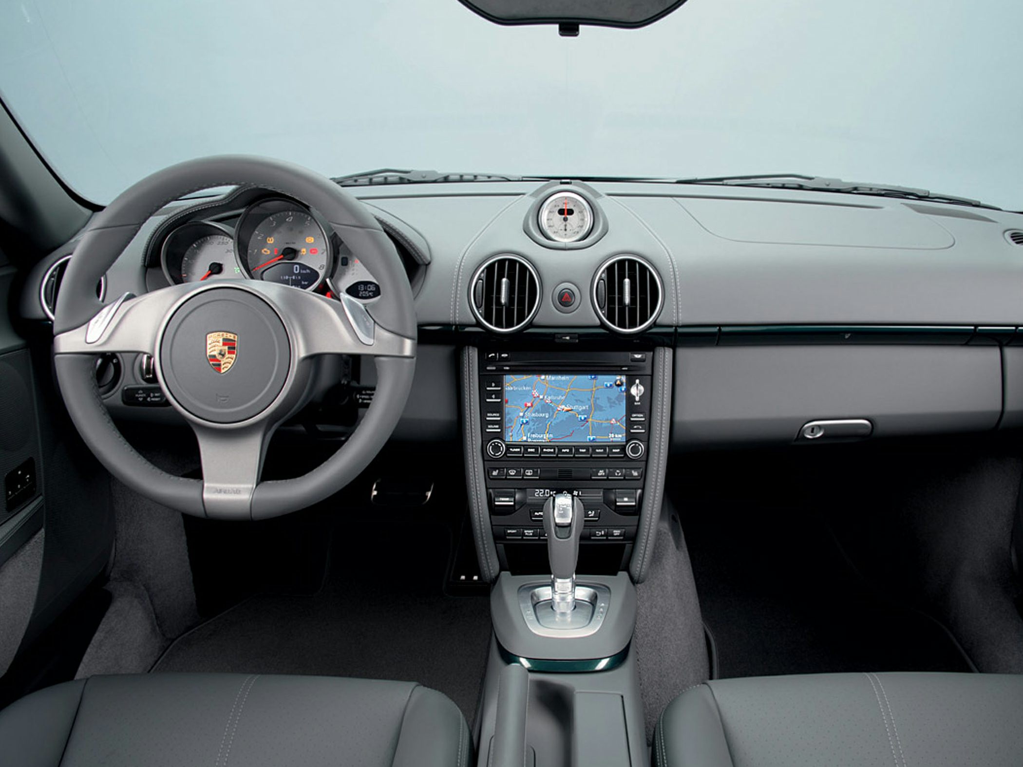 Dashboard with navigation screen and sporty steering wheel