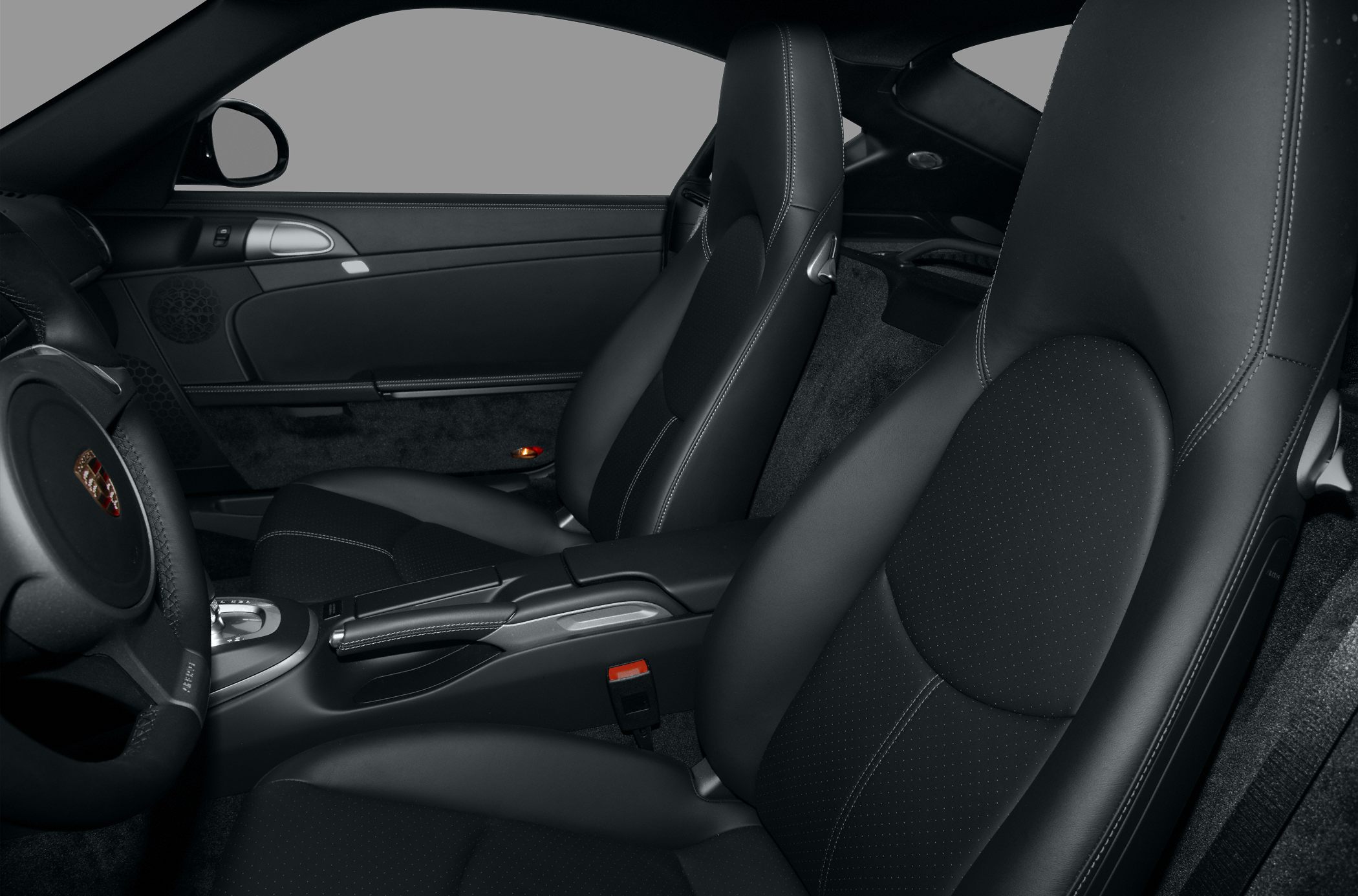 Black leather bucket seats and modern center console with handbrake and controls