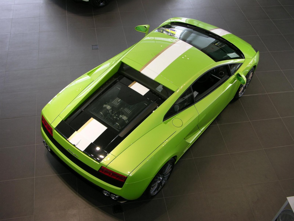 Green sports car with white stripe and visible rear engine.