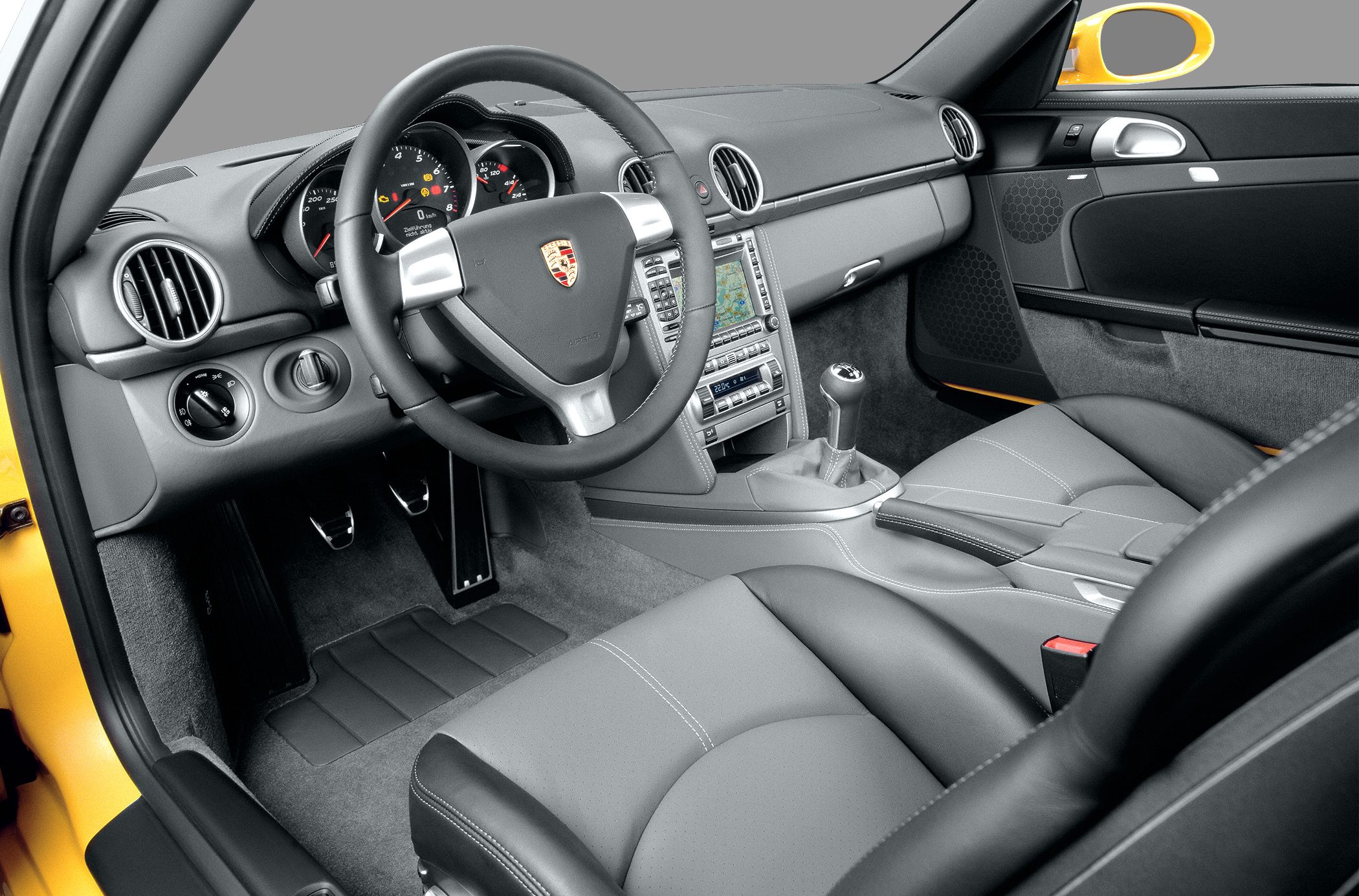 Sporty leather interior with manual transmission and detailed dashboard