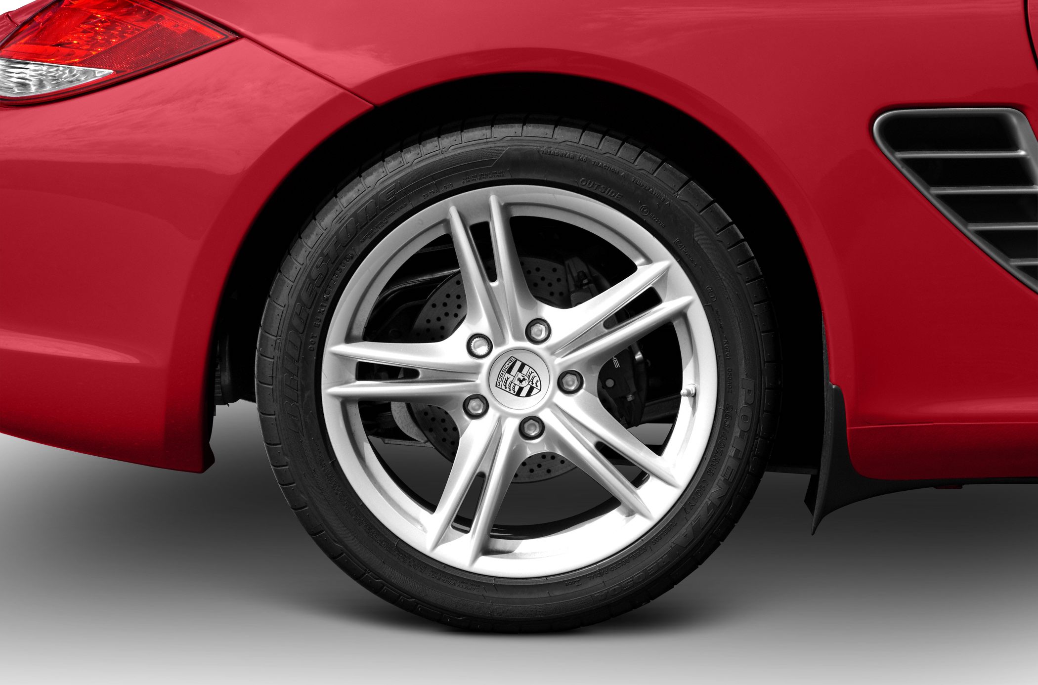 Close-up of alloy wheel and ventilated brake disc with caliper.