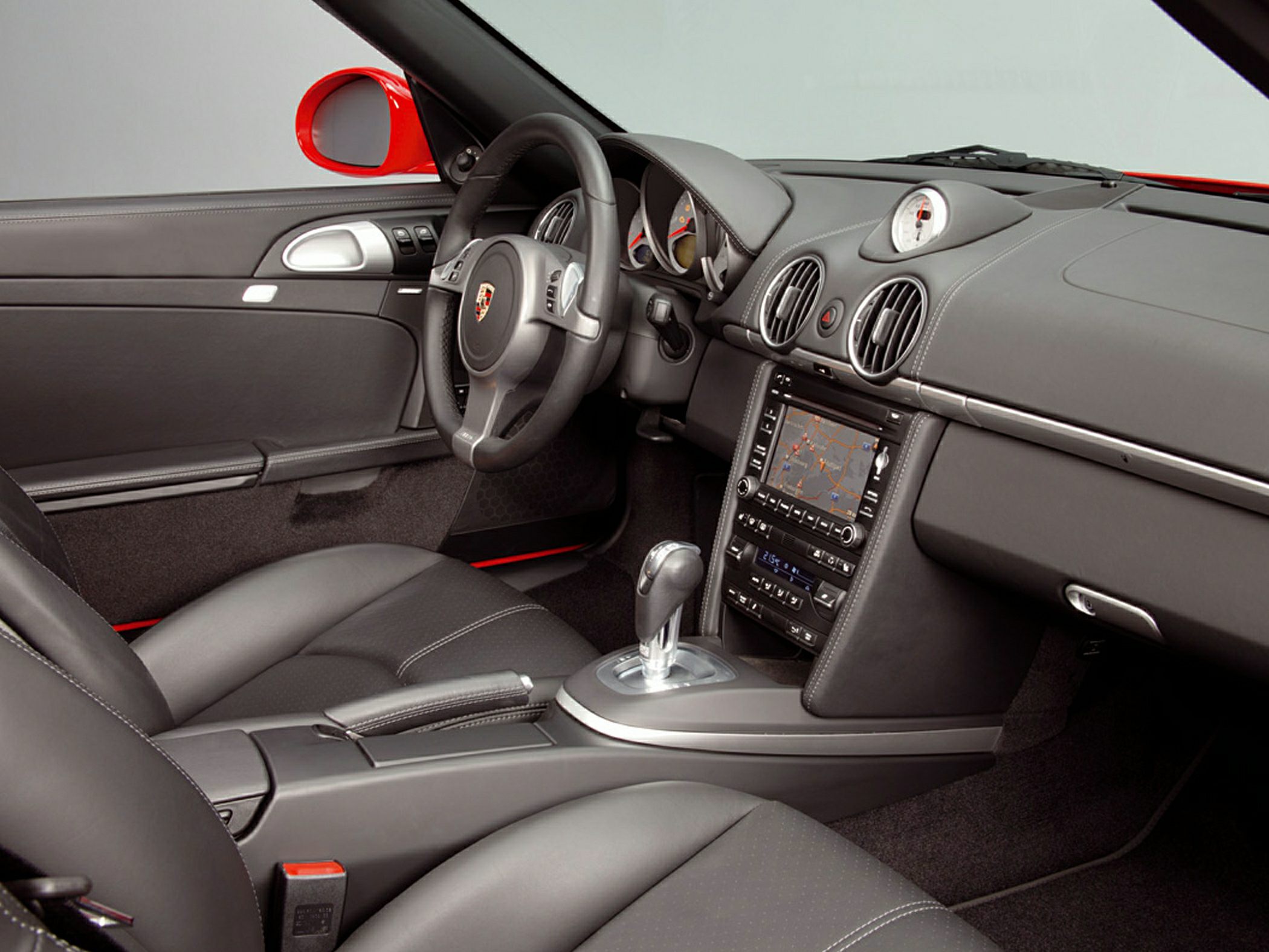 Luxury sports car interior with leather seats and navigation system