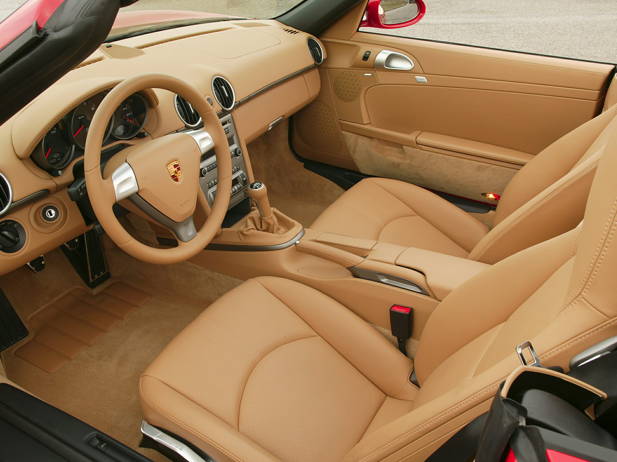 Beige leather interior with sporty steering wheel and manual gearstick