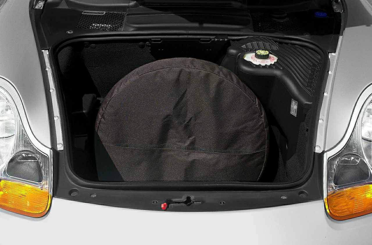 Front trunk with covered spare tire and fluid reservoir