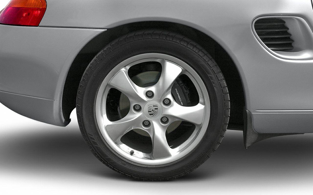 Close-up of alloy wheel with brake caliper and rear side vent.