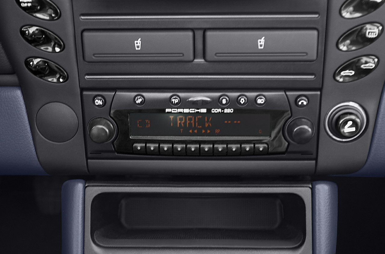 Classic car radio and heated seat controls panel.