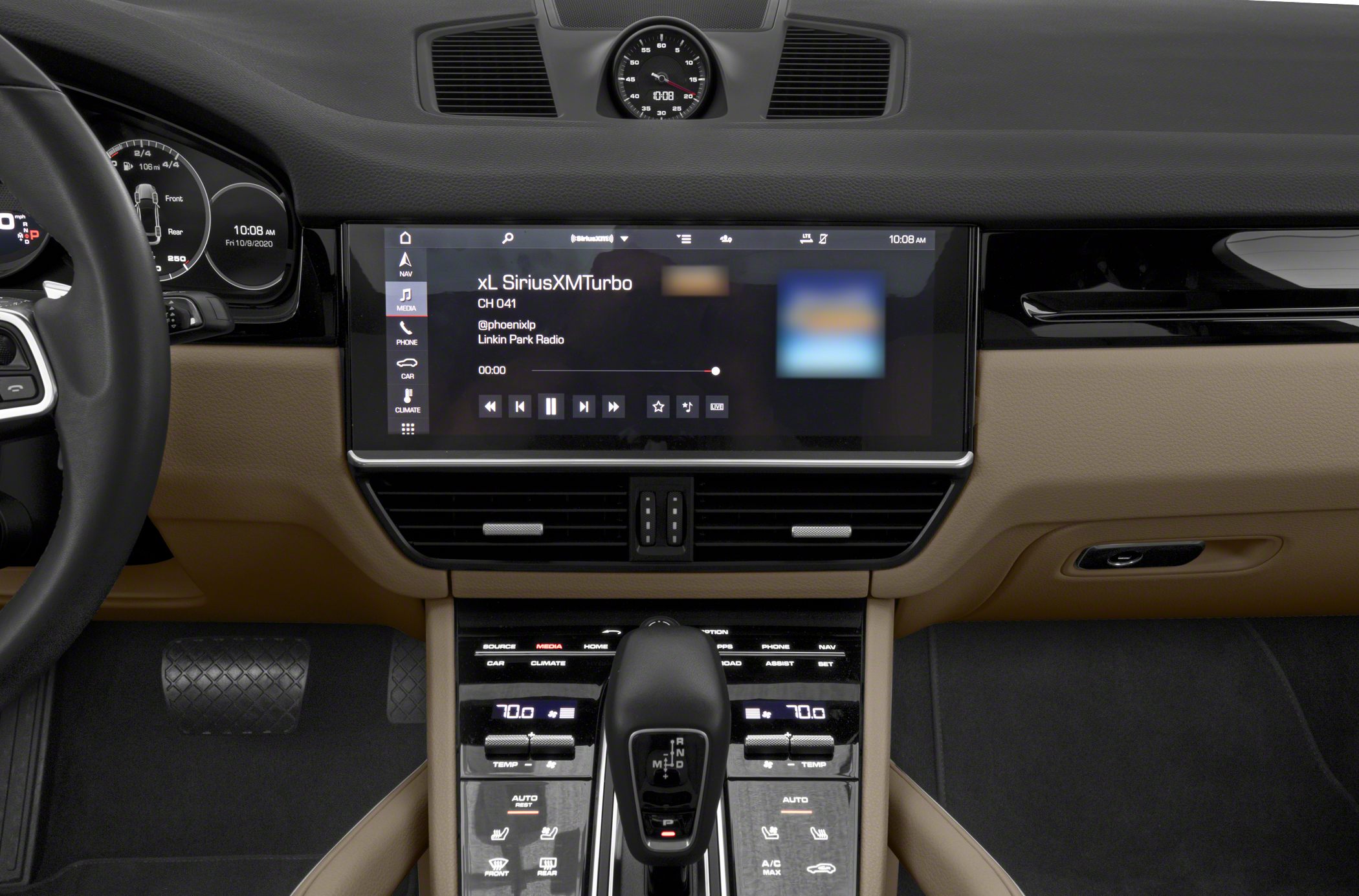 Touchscreen infotainment display and center console with gear selector and climate controls