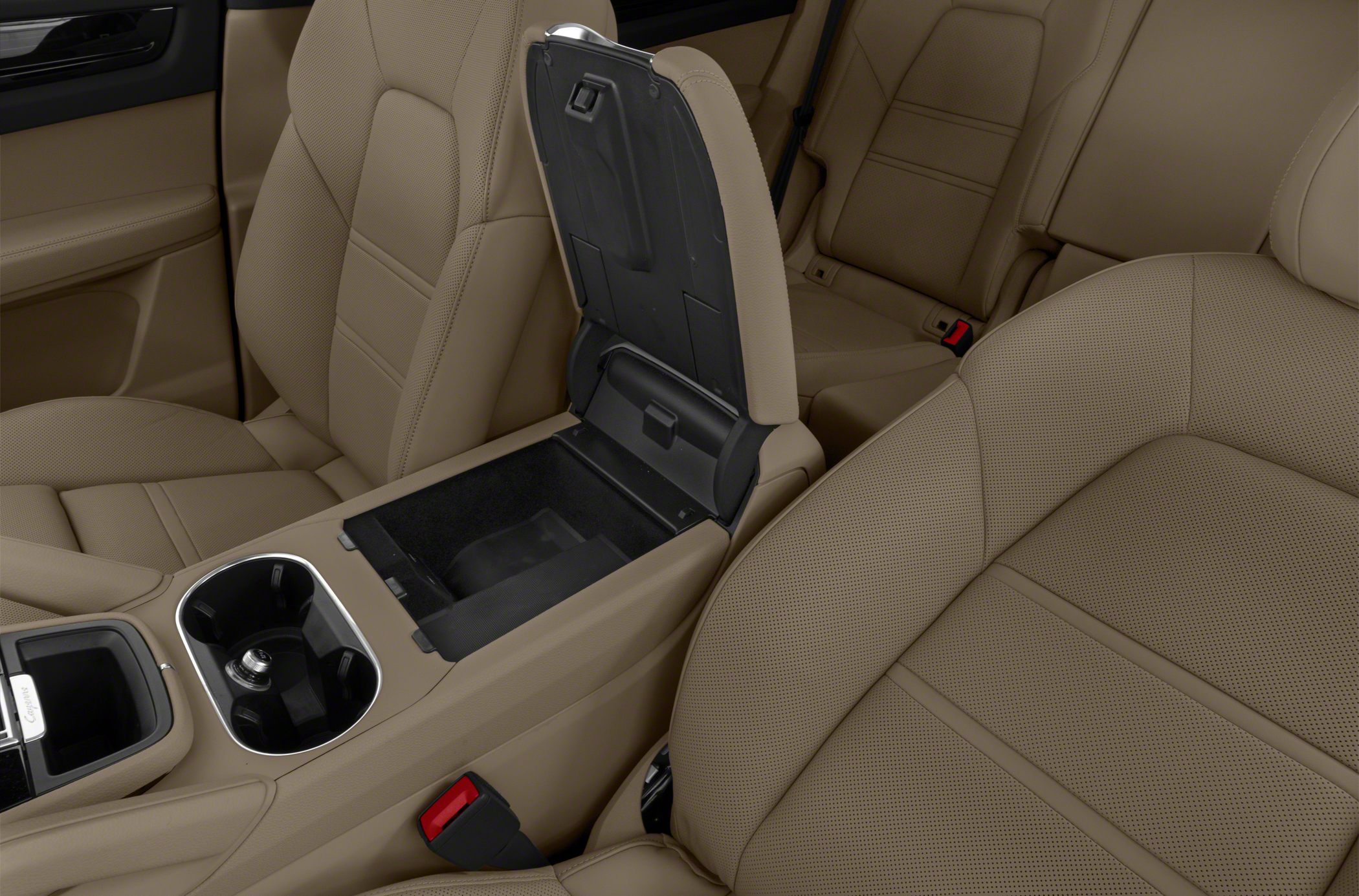 Beige perforated leather seats and open center console storage cabin