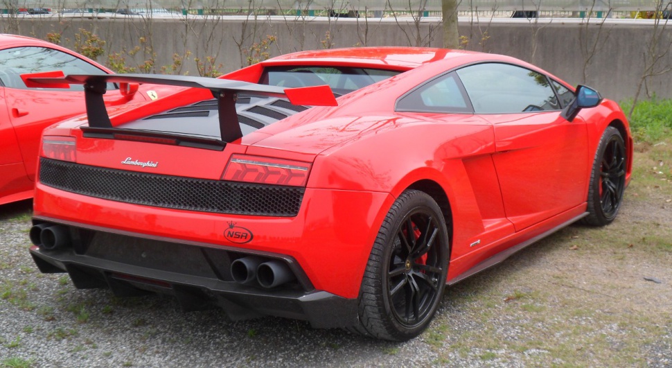 Rear view with large spoiler and quad exhausts.