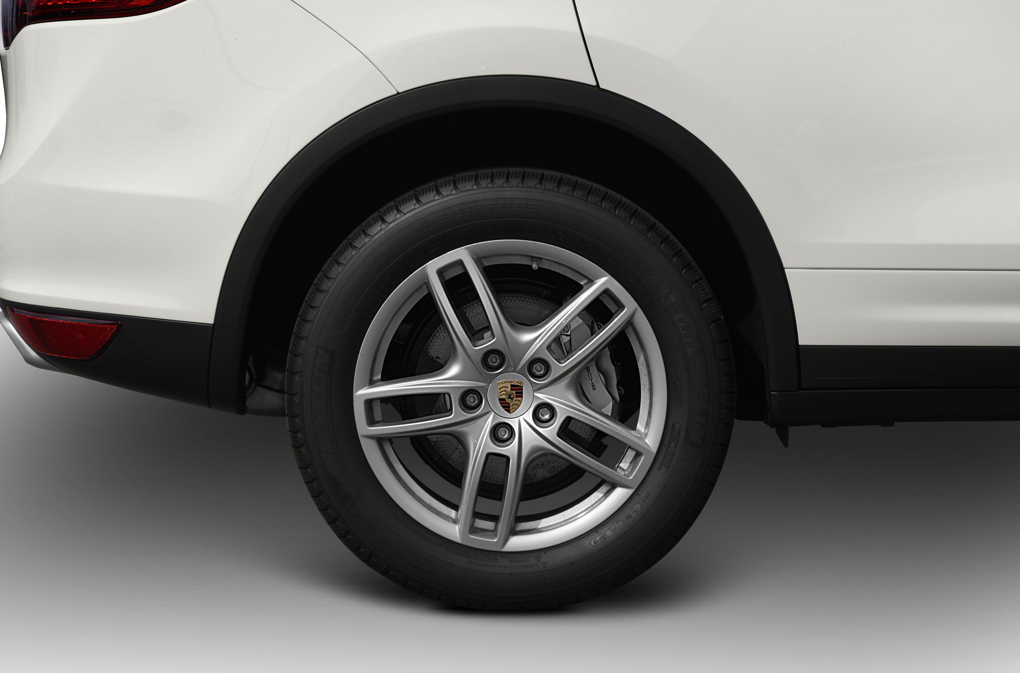 Alloy wheel and rear fender close-up with brake caliper detail