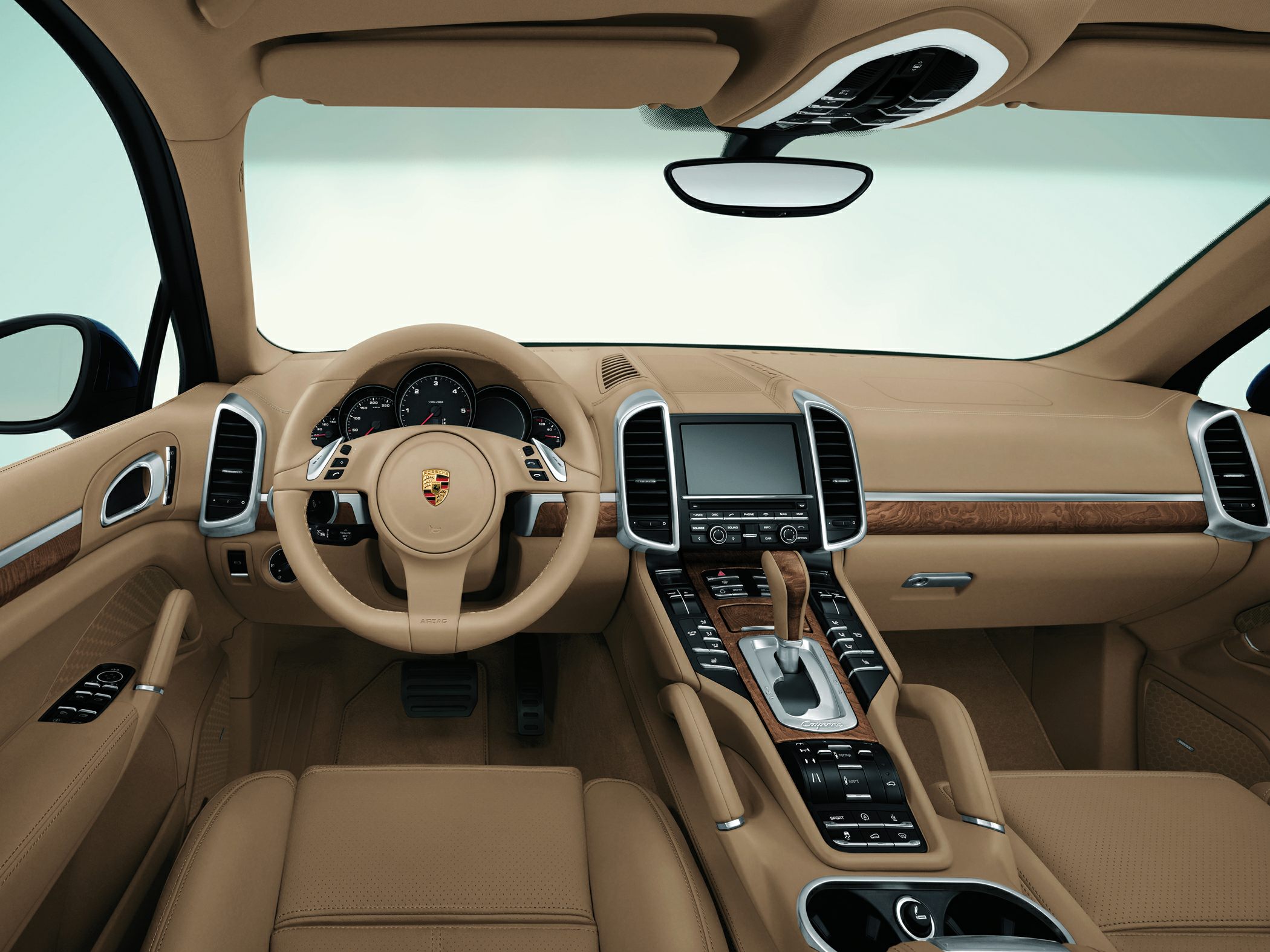 Beige luxury interior with wood trim and central console