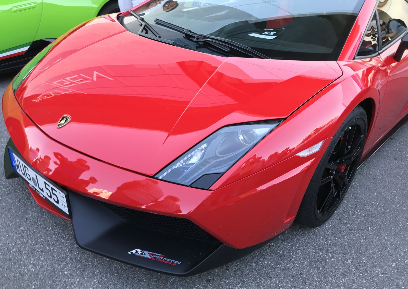 Close-up of red Lamborghini Gallardo LP 570-4 front end and headlights