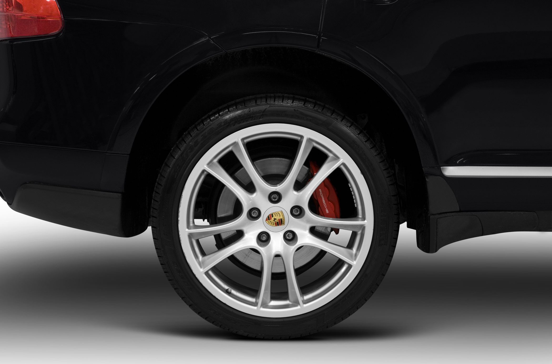 Alloy wheel with multi-spoke rim and red brake caliper
