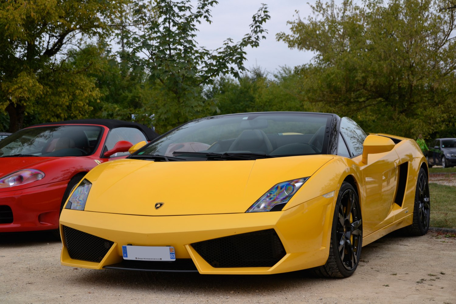 Yellow convertible with angular headlights and black wheels
