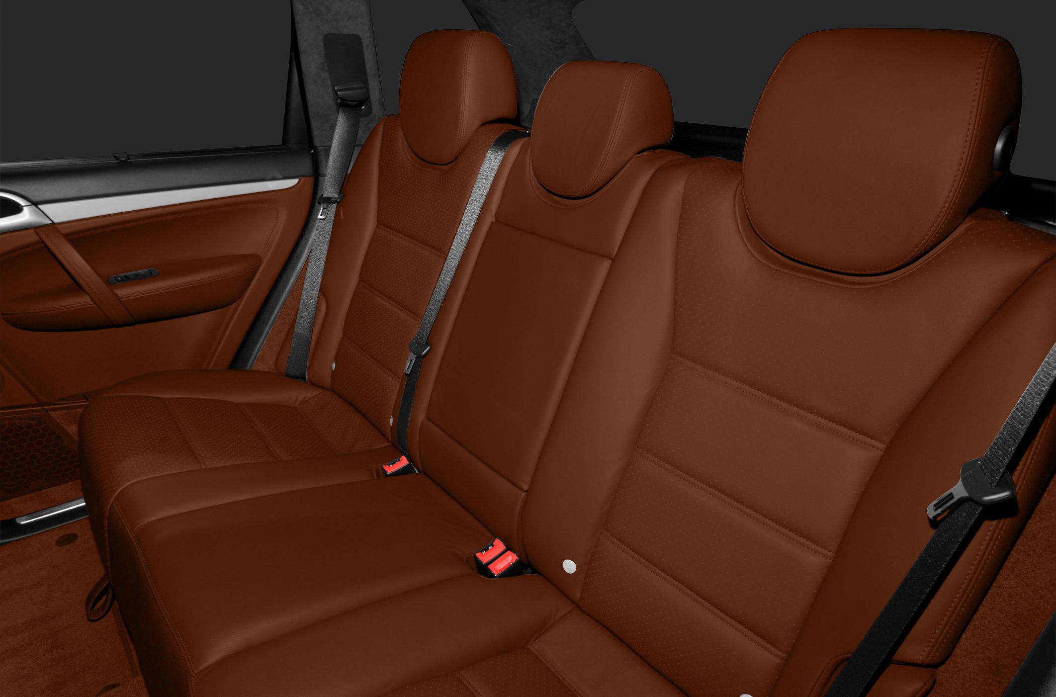 Brown leather rear seats with seat belts and door panel
