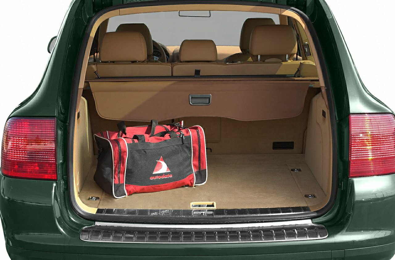 Spacious trunk and beige leather interior with cargo cover