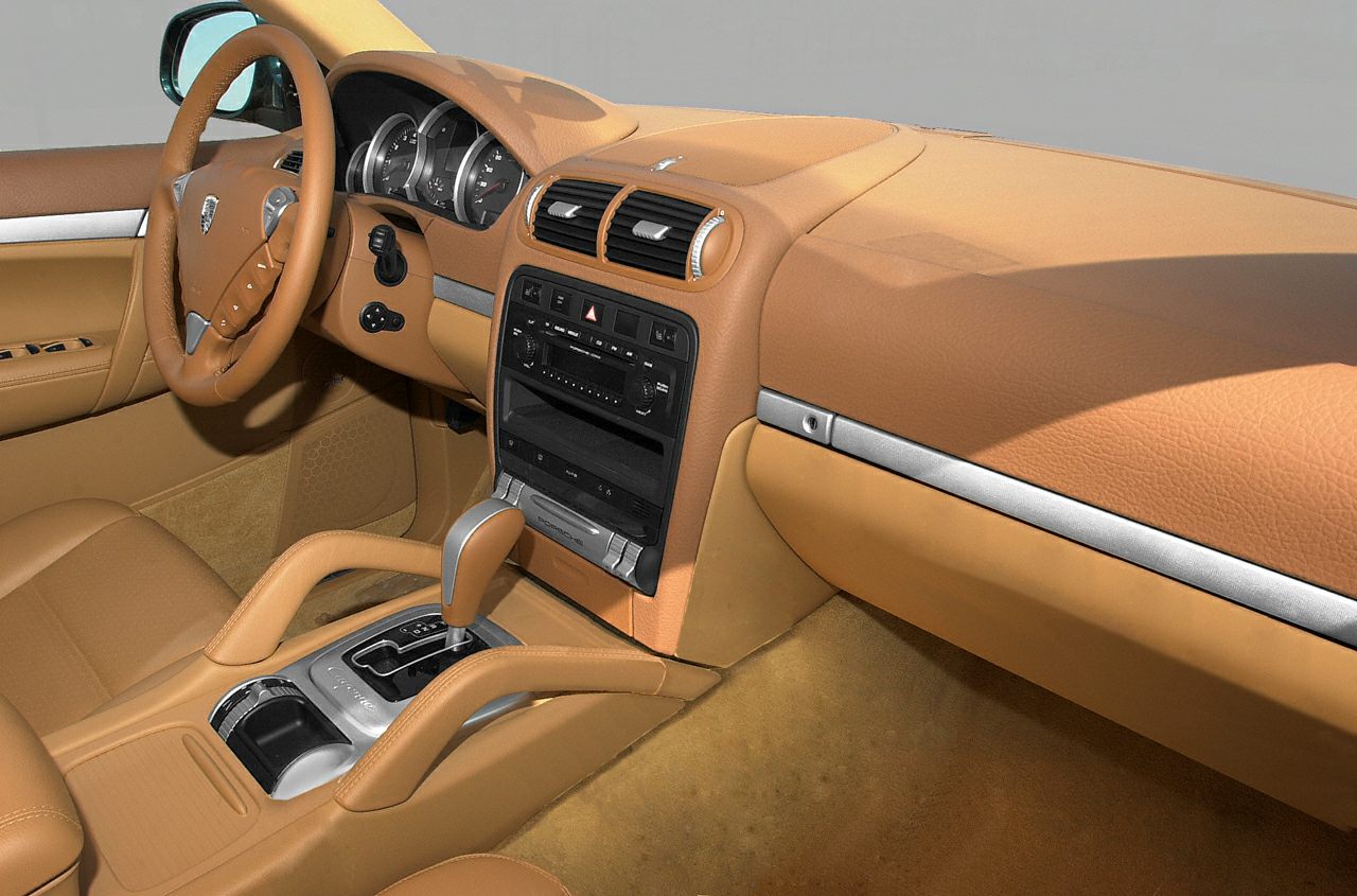 Tan leather interior with instrument panel and automatic gear shift
