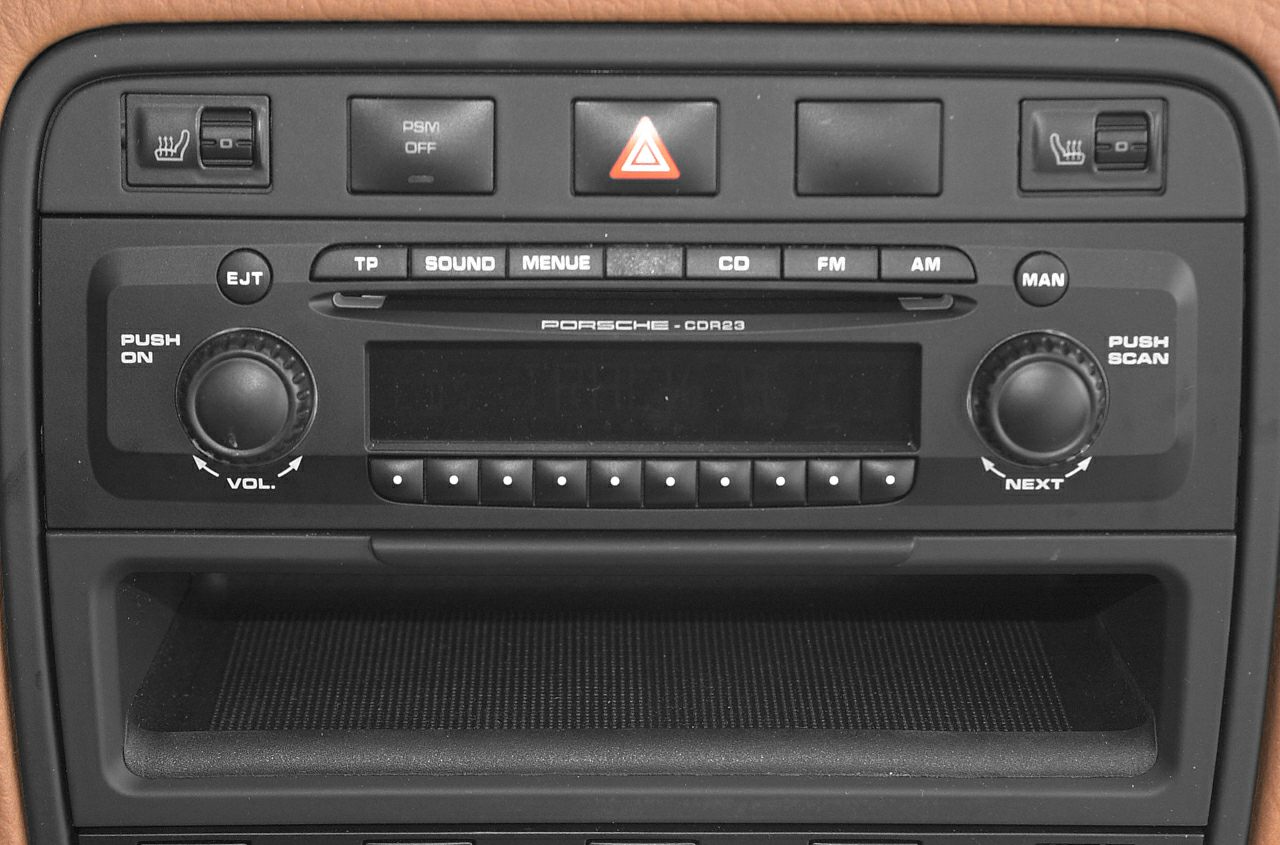 Car stereo system with control knobs and seat heater switches