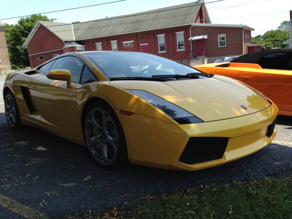 Yellow sports car with sharp headlights and aerodynamic front side