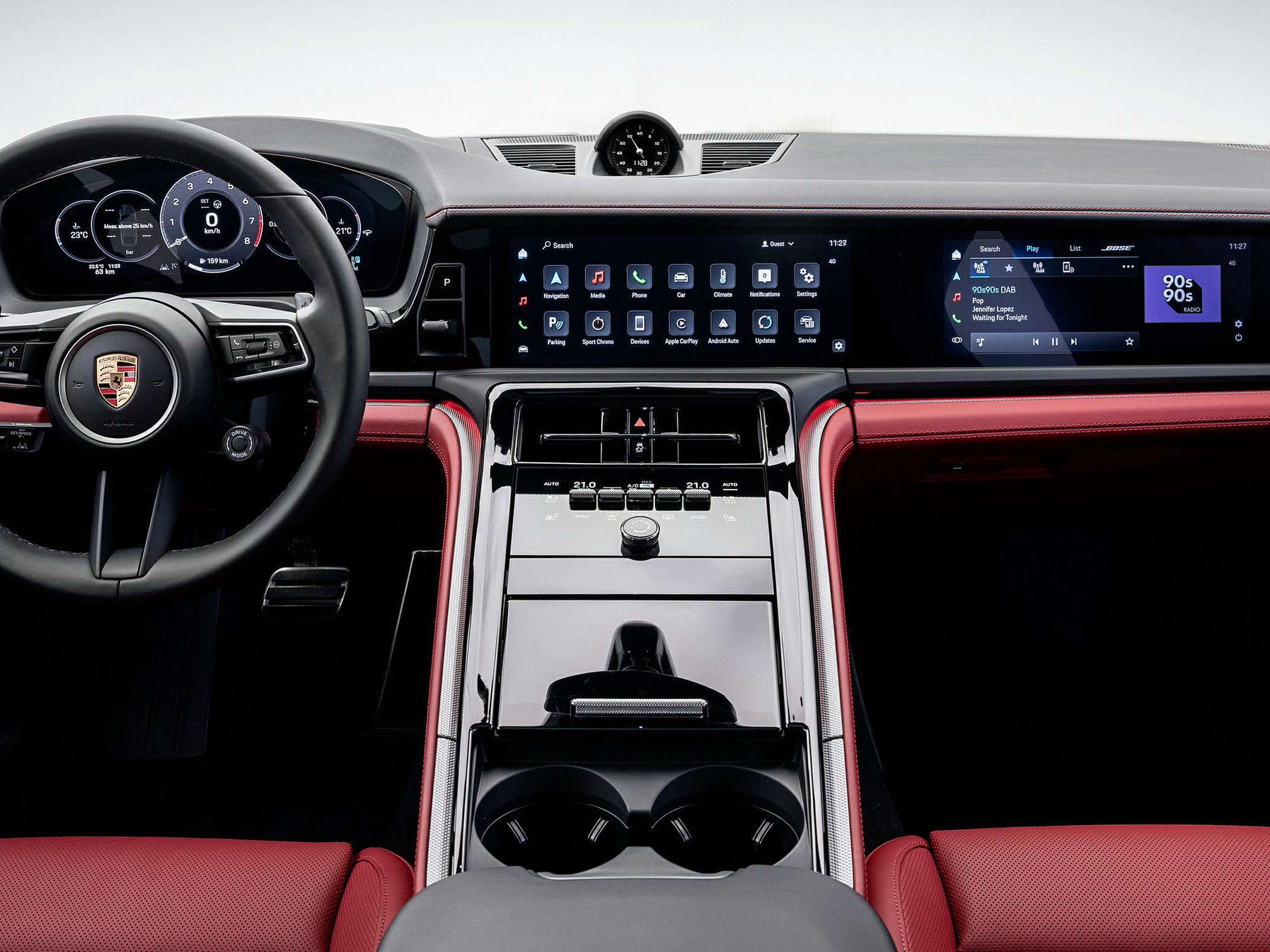 Modern digital dashboard and touchscreen center console with red leather interior accents